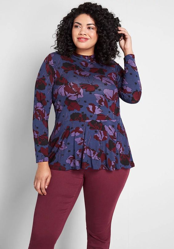 https://www.the-untidy-closet.com/wp-content/uploads/2019/12/Plus-Size-Long-Sleeve-Peplum-Top-Women-In-Navy-Floral-Print.jpg